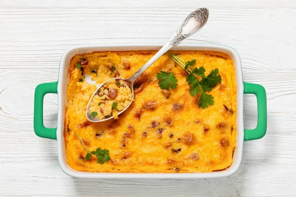 Smoked Sausage Cheese Grits Casserole Green Baking Dish Spoon White — Stock Photo, Image