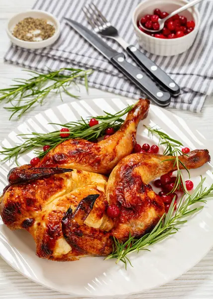 Butterflied Spatchcock Roast Whole Chicken White Plate Rosemary Cranberry Wooden Stockafbeelding