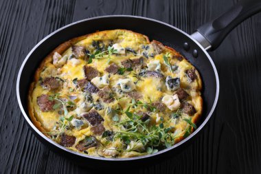 omelette with blue cheese, rye croutons and thyme clipart