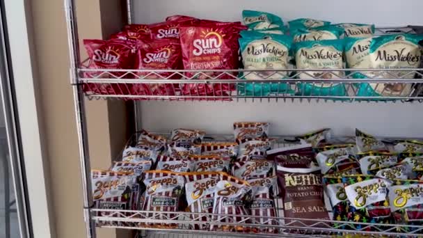 Pan Video Front Rack Filled Potato Chips Different Brands Flavors — Stock Video