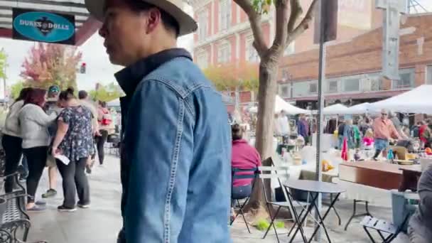 Asian Man Blue Shirt Hat Searching Someone Street Market — Stock Video