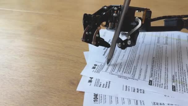 Close View Robotic Arm Poised Tax Forms Wooden Surface Symbolizing — Stock Video
