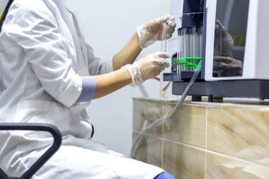 Chemistry expert is working with solutions and test tubes on the workbench in a chemistry laboratory. is a facility that provides controlled conditions in which scientific or technological research.