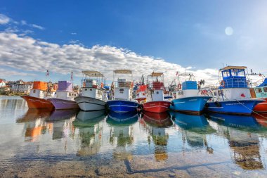 View of the different colored of the fishing boats in Black Sea area, Trabzon, Turkey.
