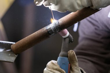 Welder qualification testing with gas tungsten arc welding (gtaw, argon) process of the stainless steel pipe. Welder certification is based on specially designed tests to determine a welder's skill.