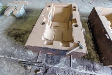 View of the sand mold casting. Sand casting, also known as sand molded casting, is a metal casting process characterized by using sand as the mold material.