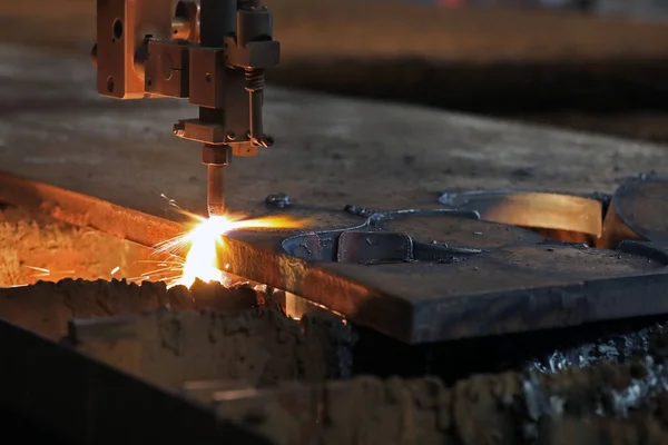 Cnc plasma cutting machine is cutting to steel plate in the factory. A Cnc plasma machine also requires a drive system, consisting of drive amplifiers, motors, encoders, and cables.