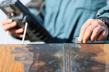 Engineer is inspection to pipe welds with ultrasonic testing. Reflected ultrasound comes from an interface, such as the back wall of the object or from an imperfection within the object.