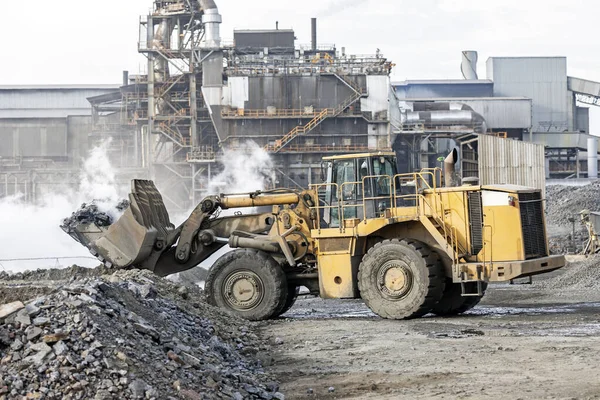 The big bulldozer and industrial pollution. Pollution is the introduction of contaminants into the natural environment that cause adverse change.