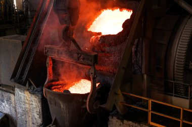 Molten copper is pouring to melting pot. Combining copper with tin and/or arsenic in the right proportions produces bronze, an alloy that is significantly harder than copper.