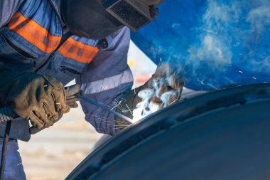 Shielded metal arc welding, manual metal arc weld, flux shielded arc weld or stick welding, is a manual arc welding process that uses a consumable electrode covered with a flux to lay the weld.