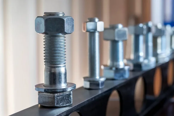 View of the bolts and nuts (fasteners). A bolt is a form of threaded fastener with an external male thread. Bolts are very closely related to screws. Bolts are often used to make a bolted joint.