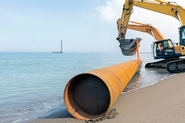 Excavators Carrying Pile Pipe Sea Pipe Piles Either Welded Seamless — 스톡 사진