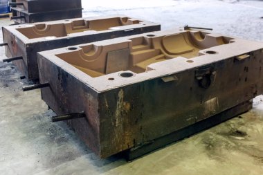 View of the sand mold casting. Sand casting, also known as sand molded casting, is a metal casting process characterized by using sand as the mold material.