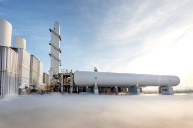 View of the industrial oxygen tanks in the chemical plant. It is an oxygen storage vessel, which is either held under pressure in gas cylinders, or as liquid oxygen in a cryogenic storage tank.