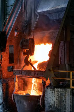 Molten copper is pouring to melting pot. Combining copper with tin and/or arsenic in the right proportions produces bronze, an alloy that is significantly harder than copper.