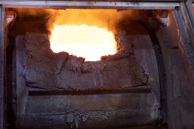 Molten copper is pouring to melting pot. Combining copper with tin and/or arsenic in the right proportions produces bronze, an alloy that is significantly harder than copper.