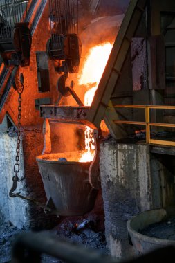 Molten copper is pouring to melting pot. Combining copper with tin and/or arsenic in the right proportions produces bronze, an alloy that is significantly harder than copper.
