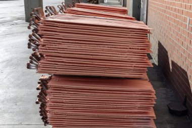 View of the copper ingots or copper cathodes as plate in the manufacture plant. American elements produces metallic copper Ingots with the highest possible density.