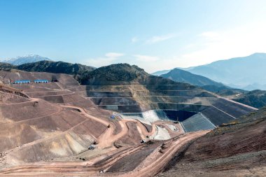 View of the industrial mine waste dam (tailing dam). A tailings dam is typically an earth-fill embankment dam used to store byproducts of mining operations after separating the ore from the gangue.