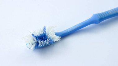 Damaged toothbrush bristles isolated on white background.