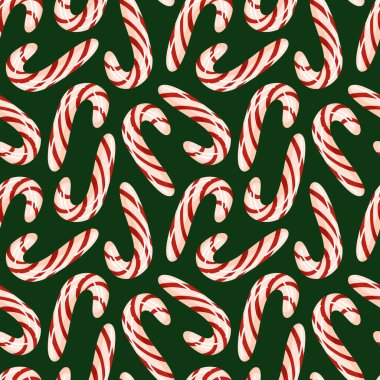 Yeşil arka planda kırmızı ve beyaz çizgili şeker kamışlı kusursuz desen. Noel tasarımı, tatil ambalajı ya da şenlikli dekorasyon için ideal.