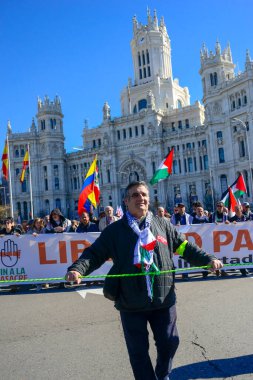 Supporters and activists during the demonstration in support of the Palestinians and a free Palestine in the centre of Madrid Spain. Madrid Spain February 17th 2024 clipart