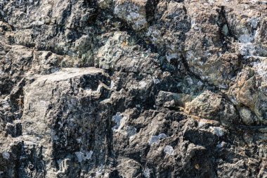 Kaya dokusu taş arka planda çatlaklar ve tasarım için kopyalama alanı