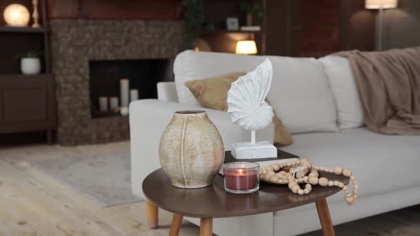 Coffee Table Stylish Decor Burning Candle Blurred Background Sofa Pillow — 비디오
