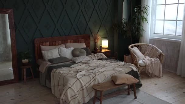 Cozy Spacious Bedroom Interior Boho Style Green Walls Wooden Furniture — стоковое видео