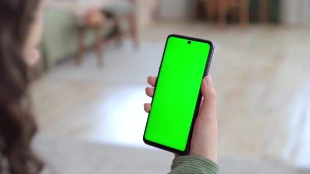 Back View Young Woman Holding Smartphone Green Screen Copy Space — Stock Video