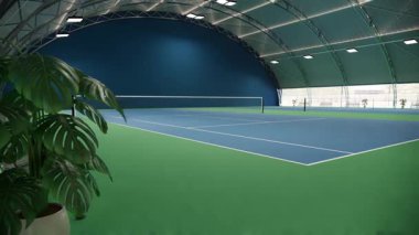 Mavi ve yeşil yüzeyi ve kıvrımlı çatı altında beyaz çizgileri olan boş bir tenis kortu