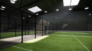 Depo binasının içinde kullanılmayan yeşil padel tenis kortları. Spor tesisi bölgesinde yer alıyor. Gün boyunca ışıklar açıkken