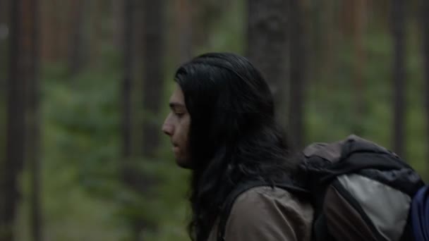 Guy Long Hair Backpack Walking Forest Hiking Forest Side View — Stockvideo