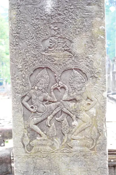 stock image This image captures intricately carved stone reliefs at Angkor Wat in Siem Reap, Cambodia, depicting historical and mythical scenes.