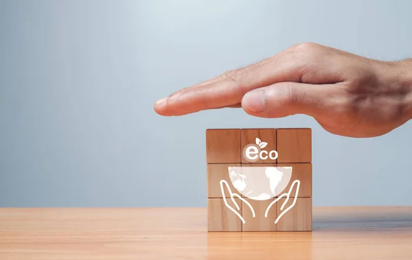 Long-term, climate-neutral strategy Hands laying wooden cubes with carbon emission reduction and green icon. Low carbon, carbon neutral concept. green banne