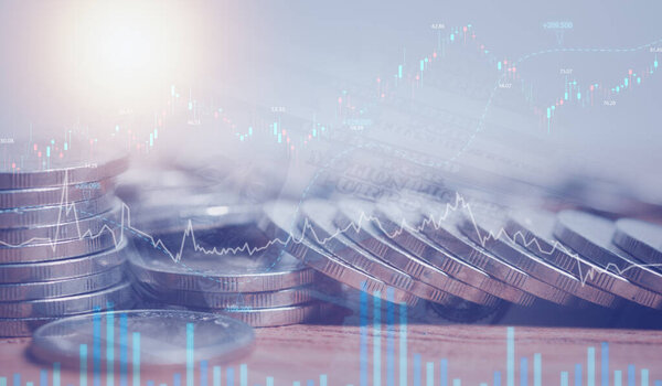 Double exposure of graph and rows of coins for finance, saving,  banking, business concept.