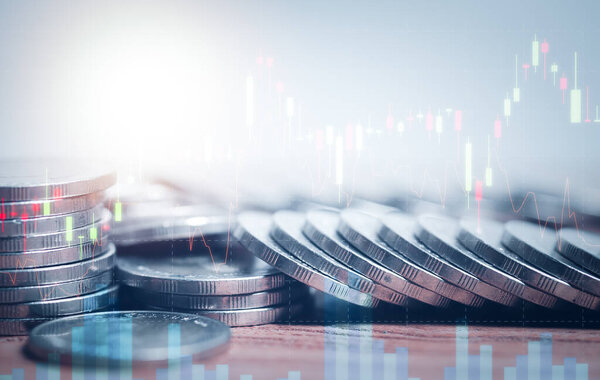 Double exposure of graph and rows of coins for finance, saving,  banking, business concept.