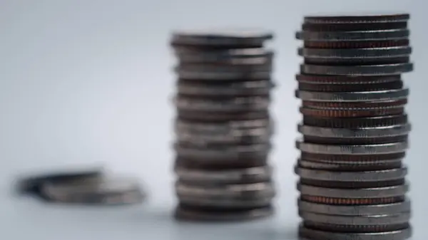 coins stacked on each other in different positions. Close-up money and currency.Savings, investments, marketing, funds, business concept.