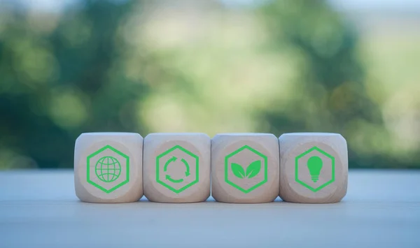 Carbon neutral concept. Net zero greenhouse gas emissions target. Climate neutral long term strategy. wooden cubes with decarbonization icon and green icon. Green banner.
