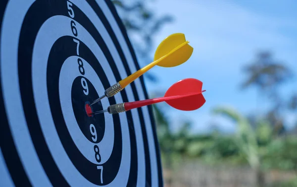 Bullseye is a target of business. Dart is an opportunity and Dartboard is the target and goal.  targeting and winning goals business.