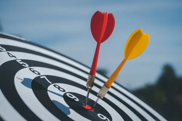 Bullseye is a target of business. Dart is an opportunity and Dartboard is the target and goal.  targeting and winning goals business.