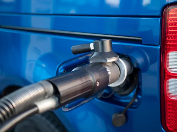 a gas nozzle of a compressed natural gas CNG powered car. High quality photo