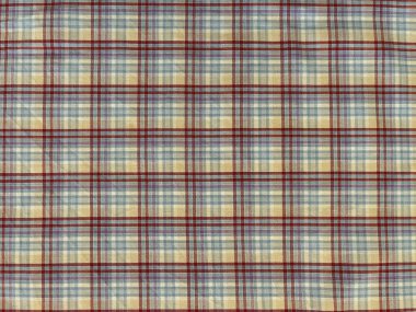 Ekose kumaş yakın plan. Çapraz beyaz, kahverengi tonlar ve siyah çizgiler, şah veya tartan desenleri. Doğal keten ya da pamuk havlu, bez, peçete. Izgaralı ve kareli tekstil ayrıntıları.