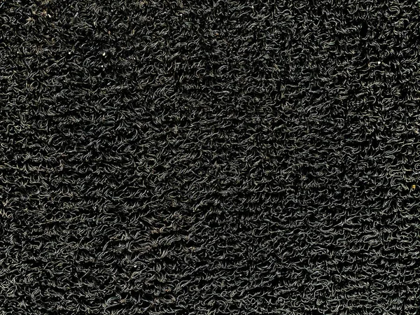 ポリ塩化ビニールのコイルの床のマットの閉鎖 背景のための質 車の床のための黒いビニールのループ マット または滑り止めのドミート 産業頑丈なマット 土か塵のトラップの表面 屋外のマット — ストック写真