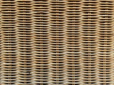 Örgü ahşap desen ya da arka plan. Rattan sepetinin dokusu. Kahverengi hasır rattan arkaplan ve doku.