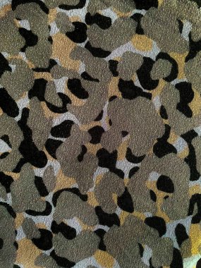 Farklı renklerde benekleri olan güzel bir arka plan, soyut bir arkaplan. Sanat kumaşı 