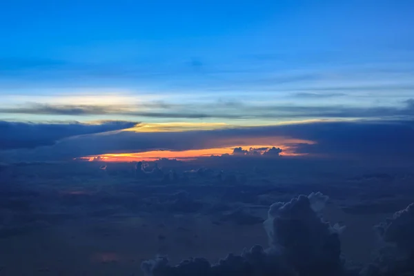 Stunning Cloudscape at sunset. View from above, out of an airplane window.