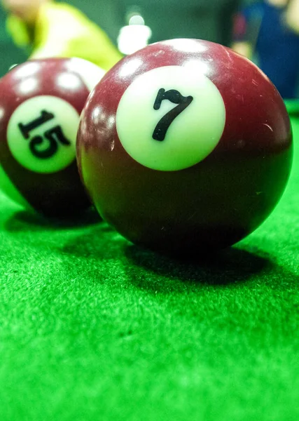 Billiard balls on table. Balls on green billiard table. Leisure and gambling concept.