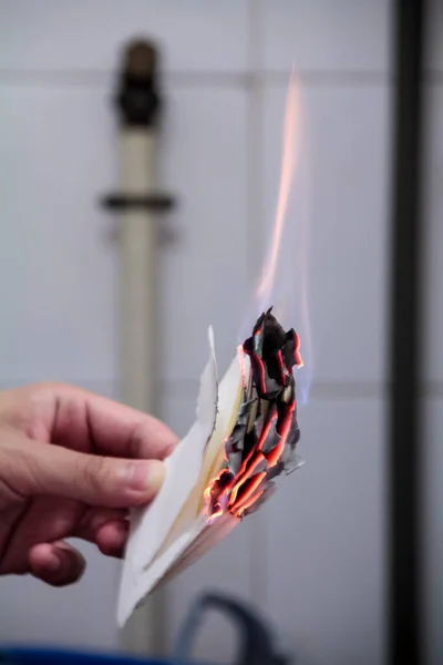Close up of the burning paper. Paper is on fire.  Paper burning in fire flame.